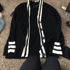 Black with white stopped cardigan very light weight not thick and has pockets